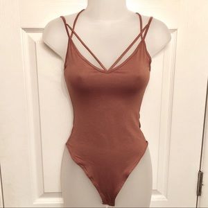 Criss cross strap body suit